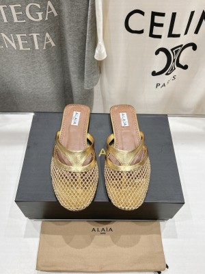 Alaïa INFRADITO FLAT MULES IN FISHNET AND LEATHER GOLD