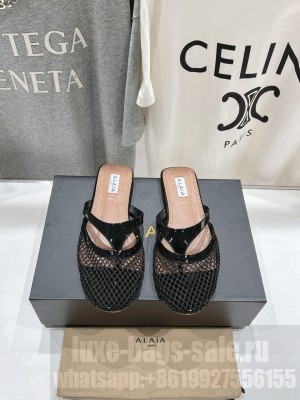 Alaïa INFRADITO FLAT MULES IN FISHNET AND LEATHER BLACK